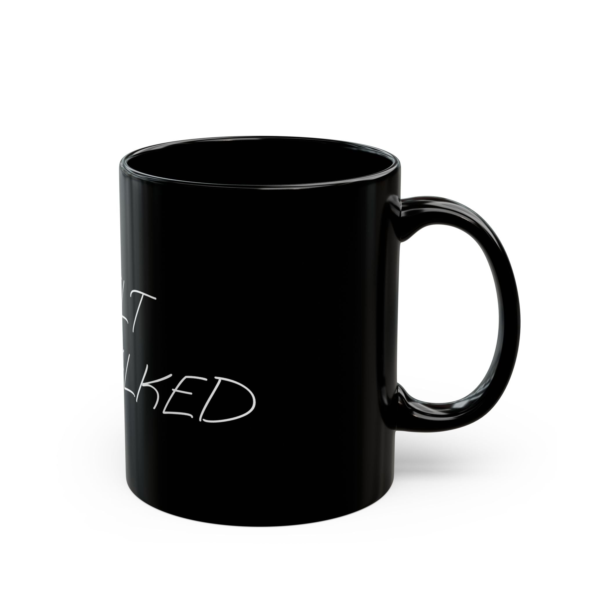 Black mug with white text on a white background