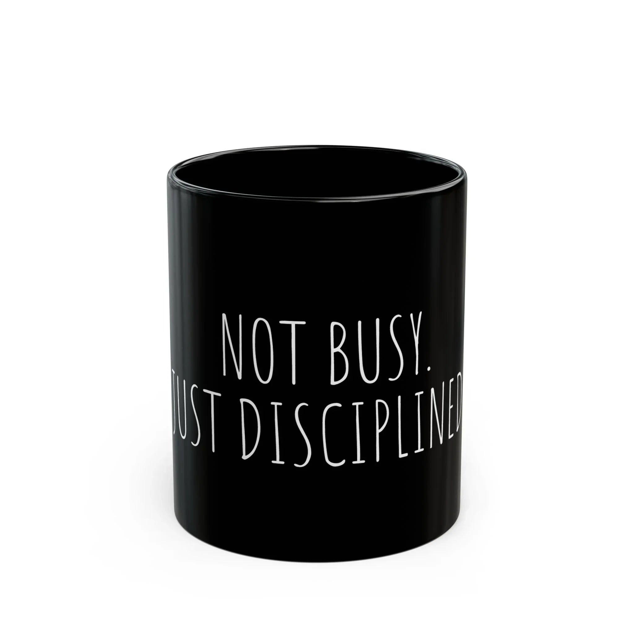 Black mug with white text 'NOT BUSY. JUST DISCIPLINED' on a white background