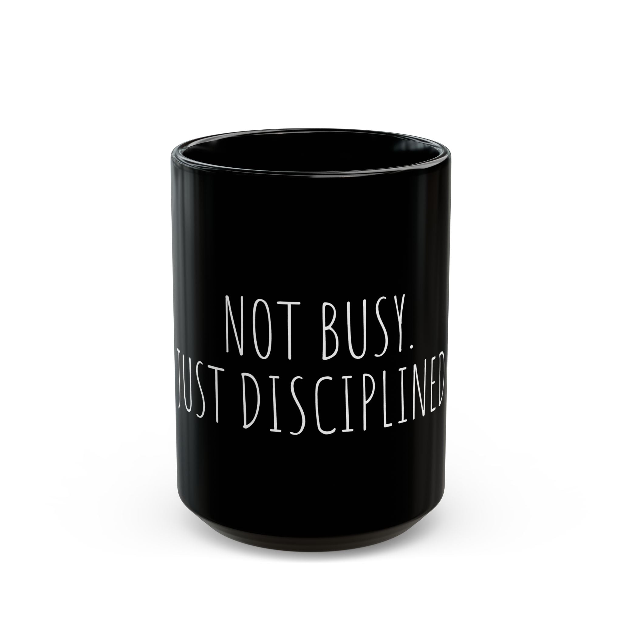Black mug with 'Not Busy. Just Disciplined' text on a white background