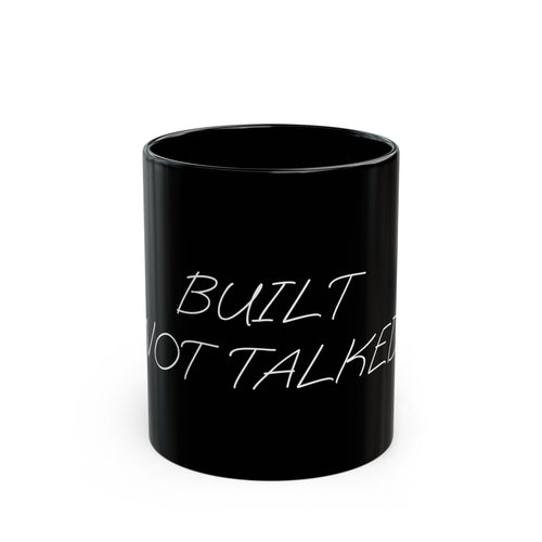 Black mug with 'BUILT NOT TALKED' text on a white background